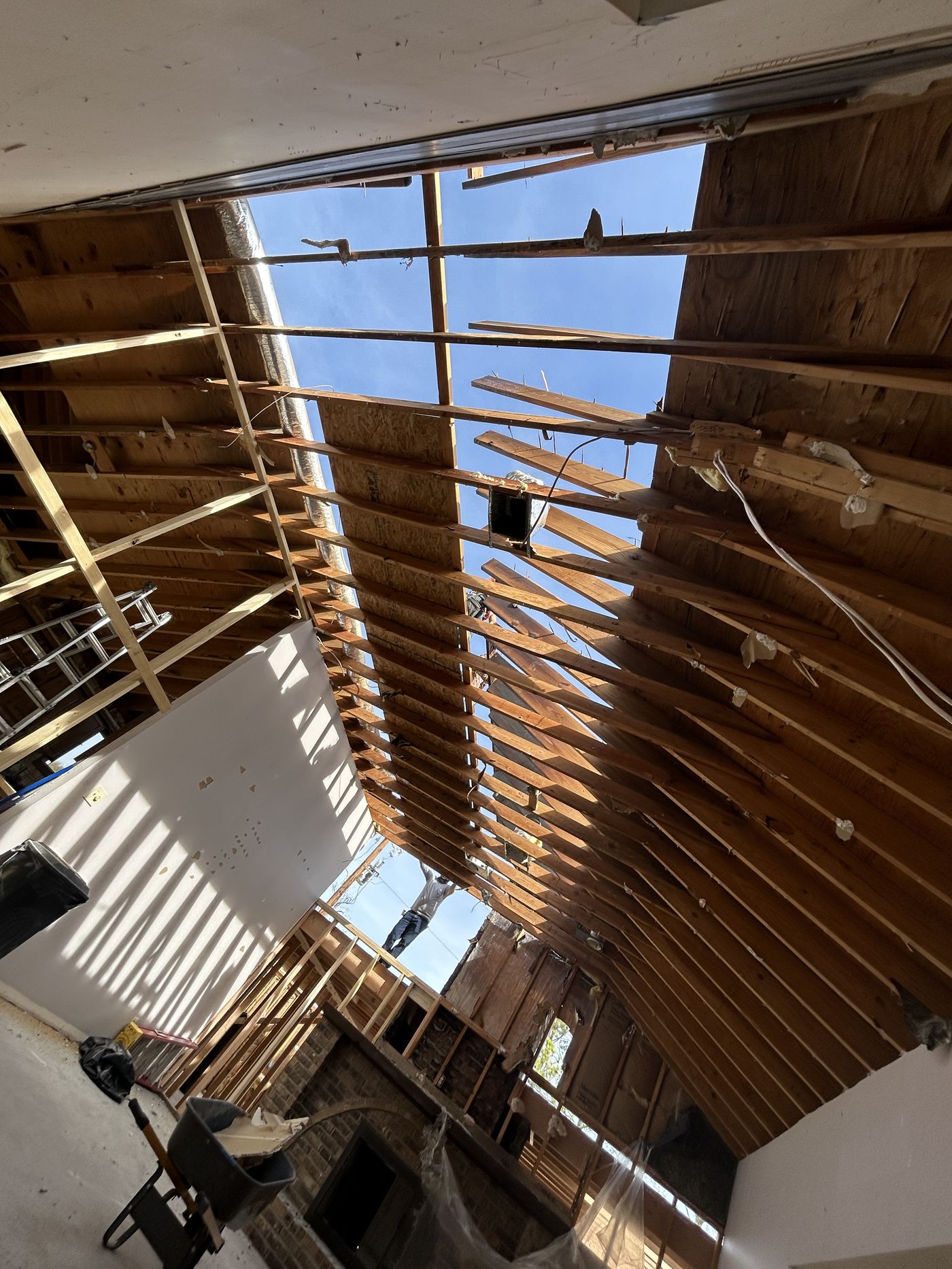 Roof structure opened to the sky during storm damage restoration in Mansfield, TX